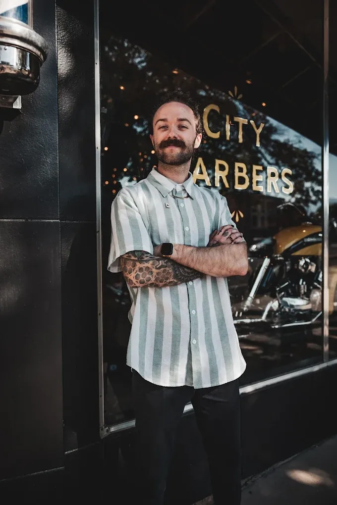 Ace outside the City Barbers storefront