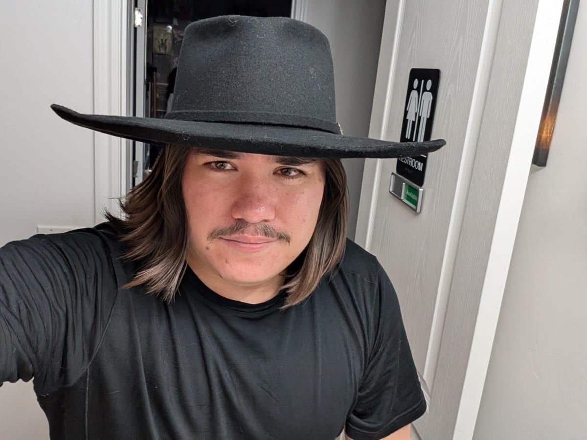 Matthew wearing one of his handmade hats